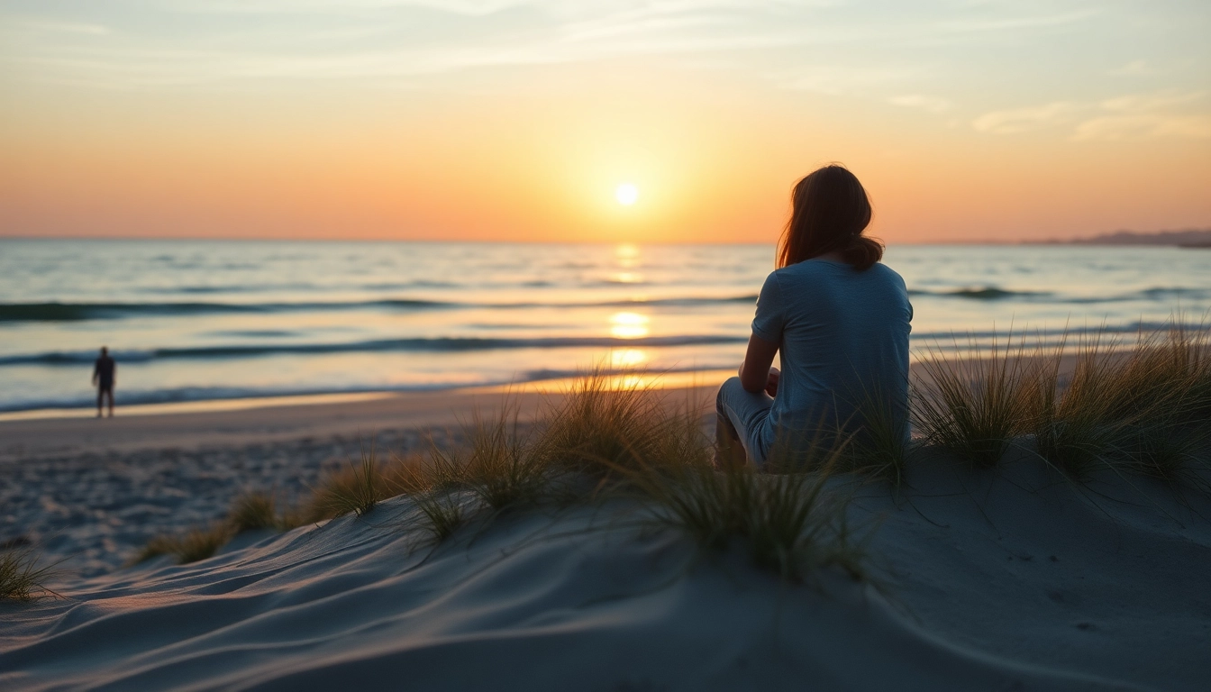 Reflective individual on the beach dealing with grief, symbolizing healing and tranquility.